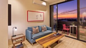 Nice living room at Distrito Centro 602 with city and sky views in downtown Cozumel
