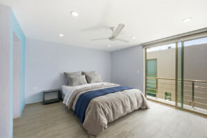 Comfortable upper-level bedroom at Sophie’s Loft, a modern furnished loft for sale in Cozumel