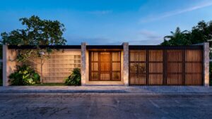 Front exterior rendering of Casa Sacbé, a contemporary custom home designed for tropical living in Cozumel.