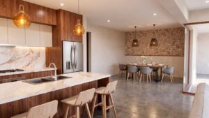 Modern kitchen in Casa Sacbé with contemporary finishes and open design for tropical living in Cozumel.