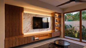 Modern living room in Casa Sacbé with contemporary TV wall and open tropical design for comfortable living in Cozumel.